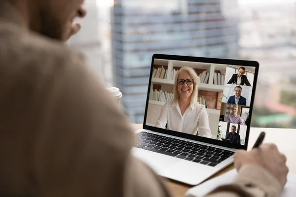 Back view of employee have webcam team meeting with colleagues — Stock Photo, Image