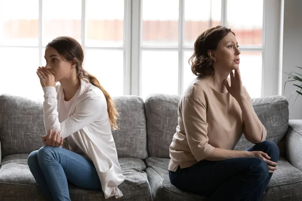 Offended grownup daughter and mature mother ignoring each other — Stock Photo, Image