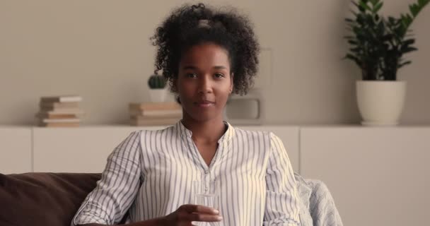 Woman outstretched her hand to camera with glass of water — Stock Video