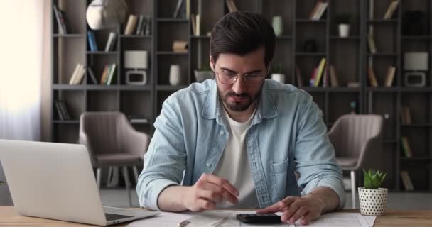 Frustrated man calculates finances feeling stressed about money lack — Stock Video