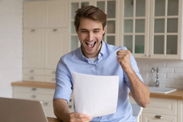 Excited man feel euphoric with good news in letter — Stock Photo, Image