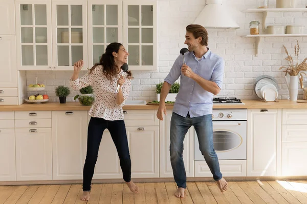 Happy couple have fun dancing together in kitchen — Stock Photo, Image