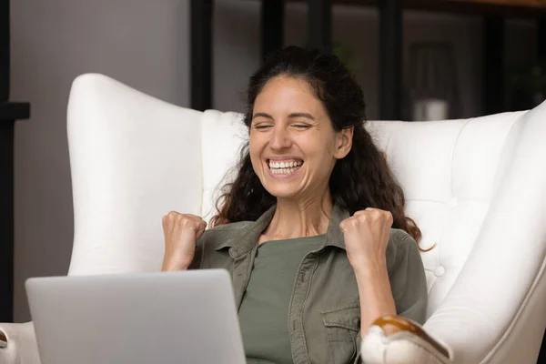 Excited woman triumph winning lottery on laptop — Stock Photo, Image