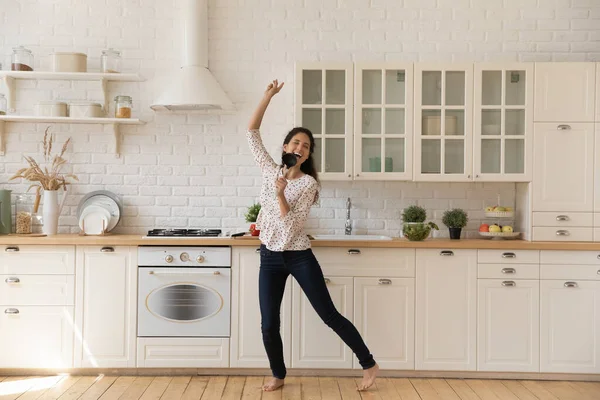 Happy millennial woman sing and dance at home — Stock Photo, Image