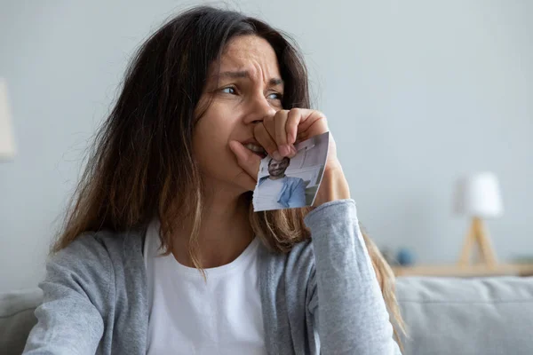 Close up crying woman holding picture of husband, break up — Stock Photo, Image