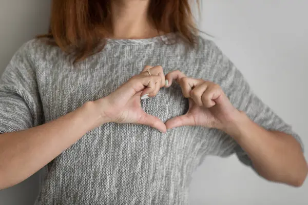 Close up of woman show love hand gesture — Stock Photo, Image