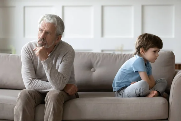 Unhappy grandfather and small grandson have fight — Stock Photo, Image