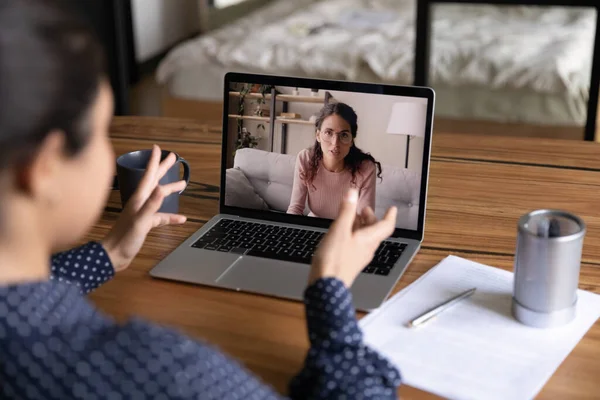 Back view of female colleagues talk on video call — Stock Photo, Image