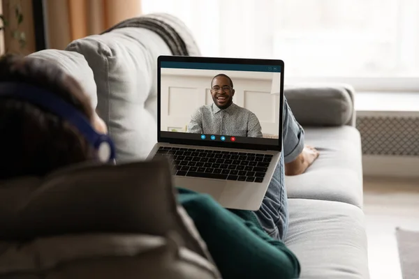 Woman relax on couch talking on video call — Stock Photo, Image