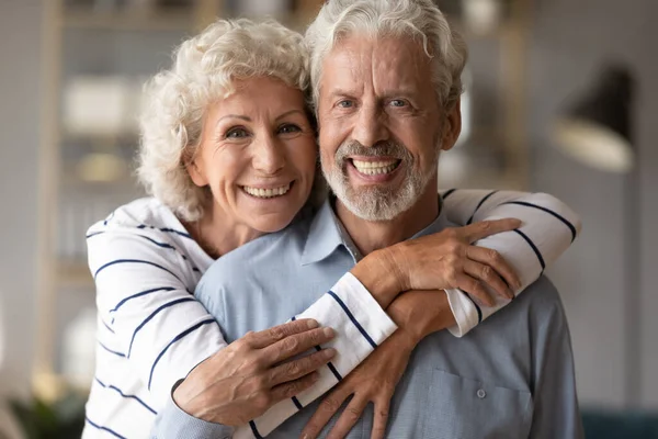 Happy loving mature married family couple looking at camera. — Stock Photo, Image