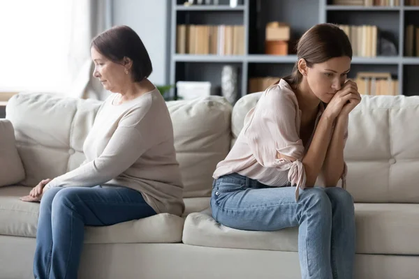 Unhappy mature mother and grownup daughter ignoring each other — Stock Photo, Image