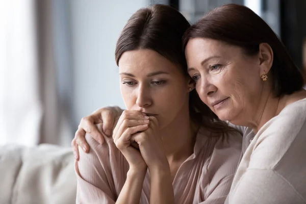 Close up loving mature mother calming frustrated grownup daughter — Stock Photo, Image