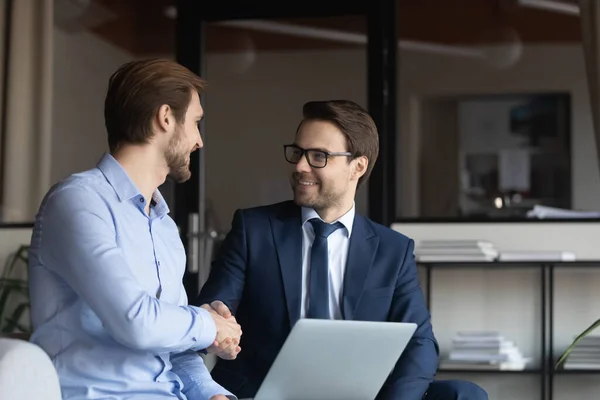 Close up smiling businessmen shaking hands, making deal in office — Stock Photo, Image