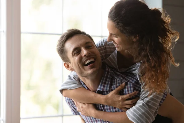 Happy millennial couple have fun on family weekend at home — Stock Photo, Image