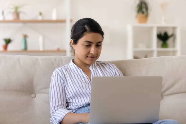 Focused mixed race female browse job seeking websites using laptop — Stock Photo, Image