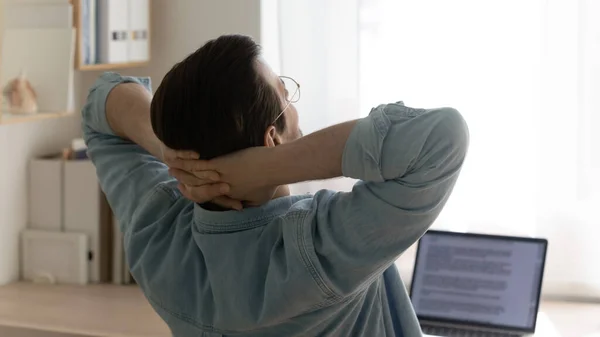 Young man freelancer taking short break of routine computer work — Stock Photo, Image