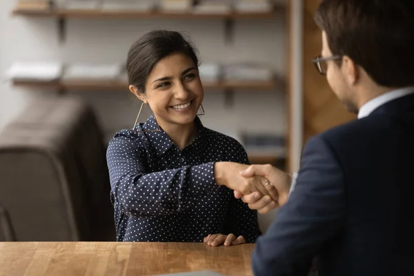 Happy indian female shaking hand of male hr getting job — Stock Photo, Image