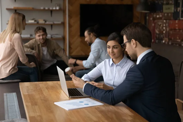 Confident leader instruct young mixed race woman new staff member — Stock Photo, Image