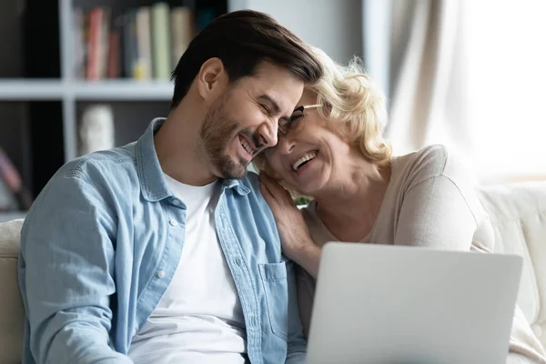 Bonding happy two generations family laughing, watching funny video online. — Stockfoto