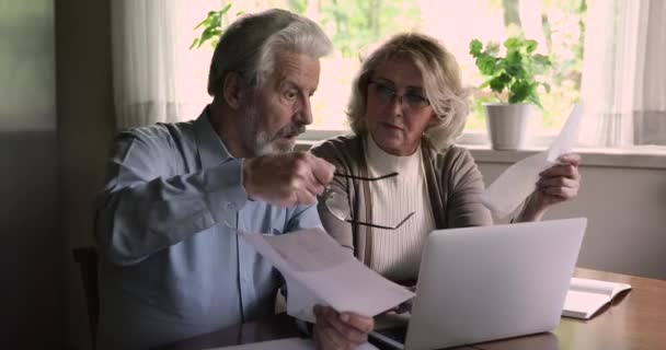 Unhappy middle aged family couple feeling shocked of financial problems. — Stock Video