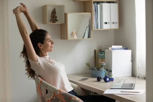 Happy young woman satisfied with finishing work relax stretch muscles — Stock Photo, Image