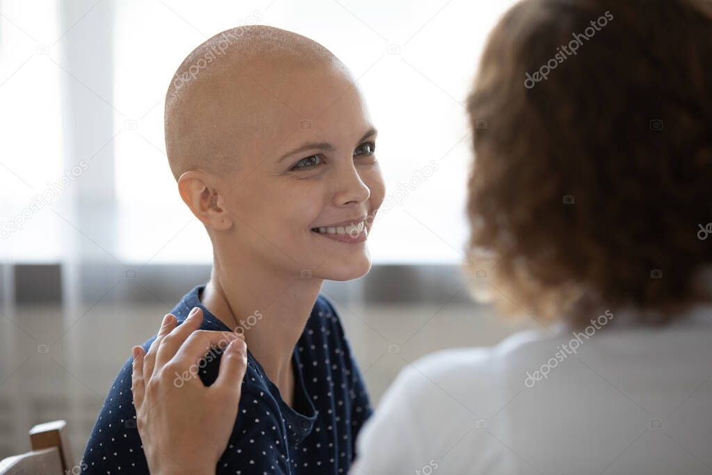 Happy hairless female cancer patient feel optimistic