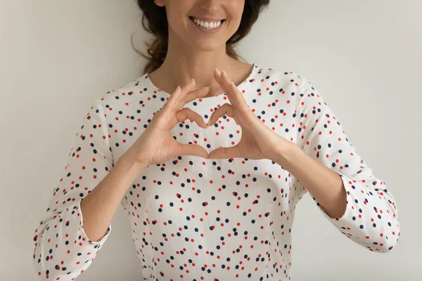 Close up of woman show heart hand gesture — ストック写真