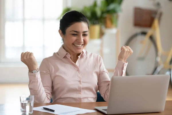 Happy professional celebrating success and making winner gesture — Stock Photo, Image