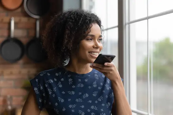Close up smiling African American woman recording voice message — Stock Photo, Image