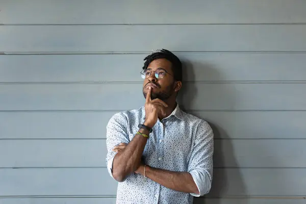 Head shot portrait thoughtful African American man on grey background — Stock Photo, Image