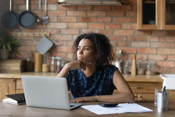 Close up thoughtful African American woman touching chin — Stock Photo, Image