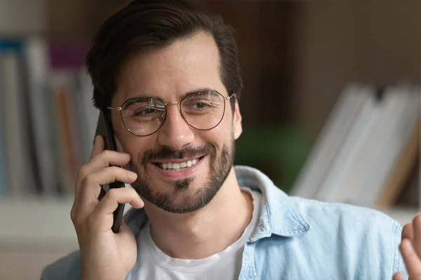 Smiling Caucasian man have pleasant call on smartphone — Stock Photo, Image