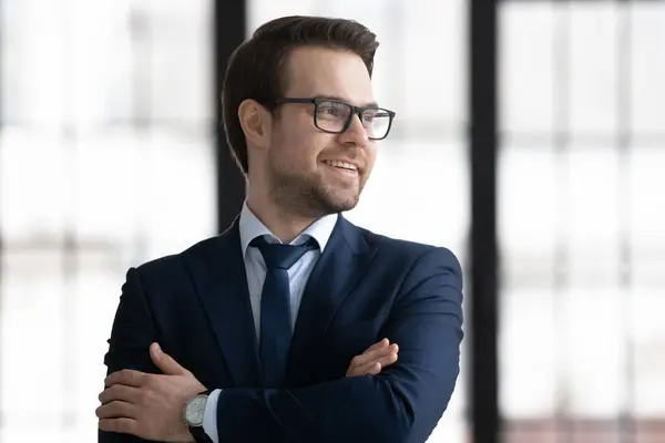 Smiling Caucasian businessman look in distance thinking — Stock Photo, Image