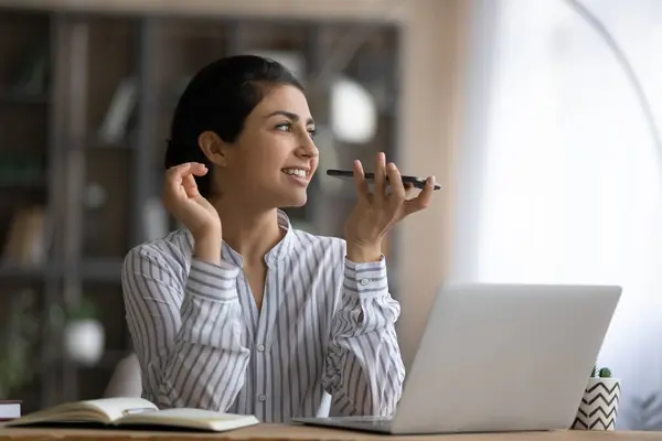 Young Indian woman use cellphone talking on loudspeaker — Stock Photo, Image