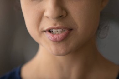 Close up of ethnic woman lips talk clipart