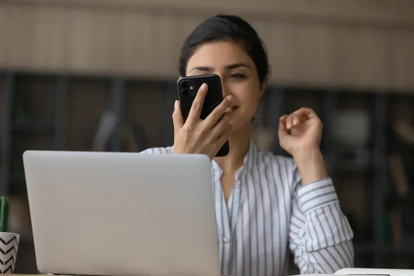Millennial Indian woman use modern electronic gadgets