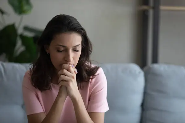 Worried young arabian woman praying god trying to concentrate — Stock Photo, Image