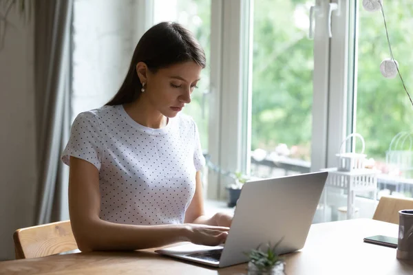 Millennial woman work online on laptop at home — Stock Photo, Image