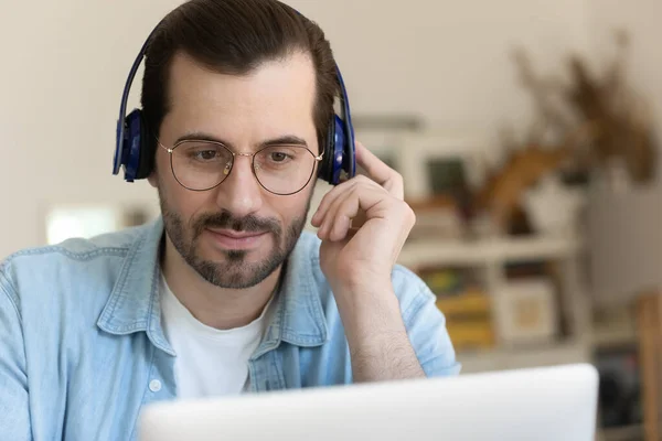 Millennial man in headphones talk on video call — Stock Photo, Image