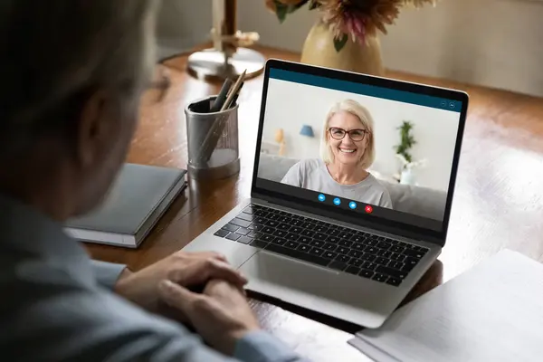 Happy mature couple chatting online via video call — Stock Photo, Image