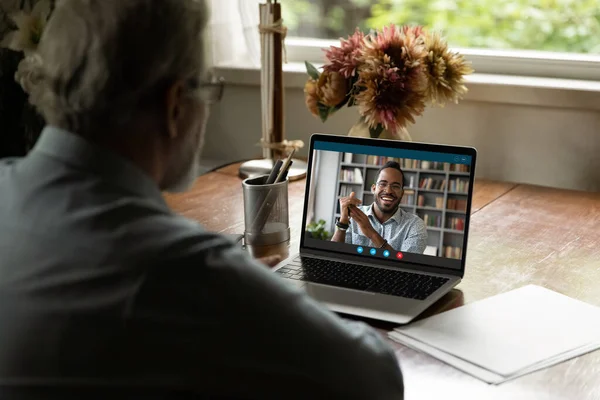 Screen view of happy black young man talking to father