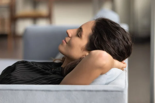 Close up profile calm woman relaxing, leaning back on couch — Stock Photo, Image