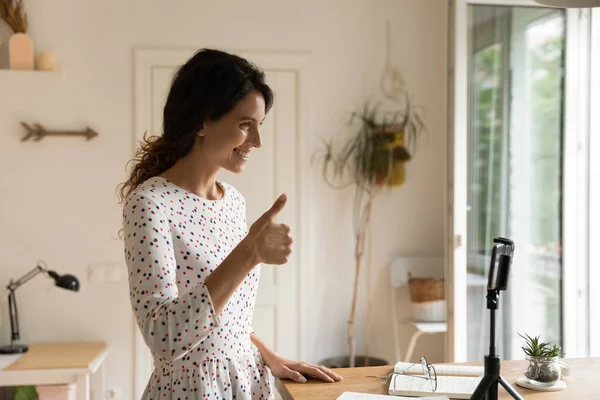 Enthusiastic woman teacher talk on smartphone webcam show thumb up — Stock Photo, Image