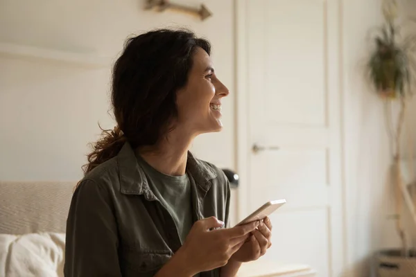 Joyful lady hold smartphone dream taken with idea found online — Stock Photo, Image