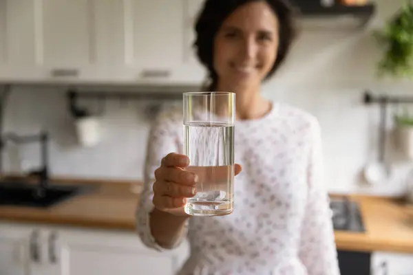 Young woman propose to start morning from glass of water — Stock Photo, Image