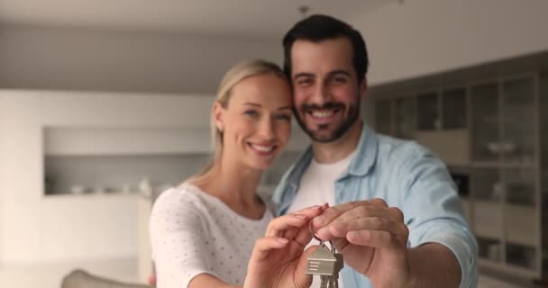 Happy couple smiling show to camera bunch of keys — Stock Video