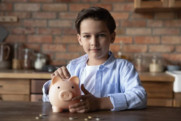 Portrait of small boy save money in piggybank — Stock Photo, Image
