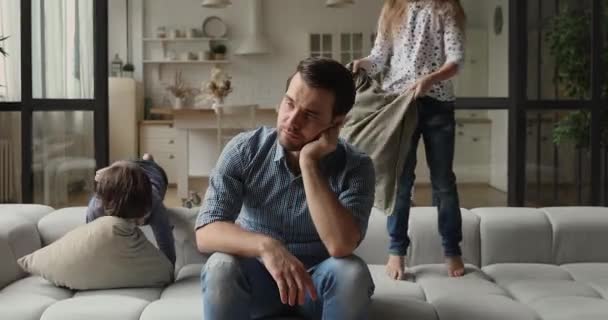 Father feels annoyed and fatigued due noisy hyperactive children — Stock Video