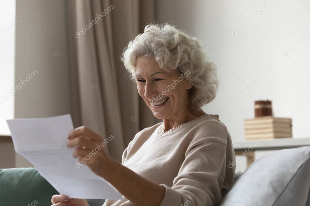 Happy elderly 60s excited about good news