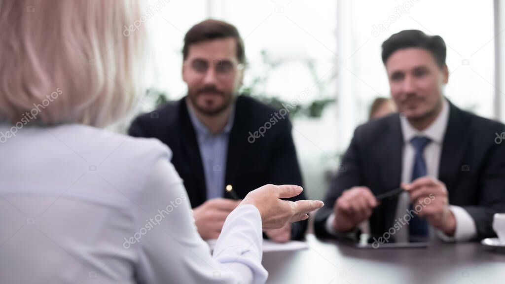 Close up of female applicant talk with employers